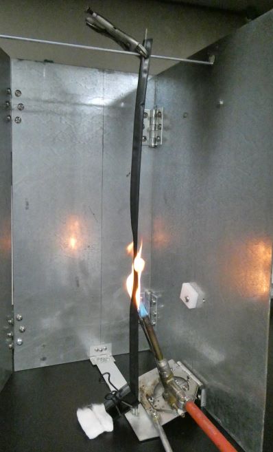  Photograph of a flame test on a sample piece of heat shrink insulation